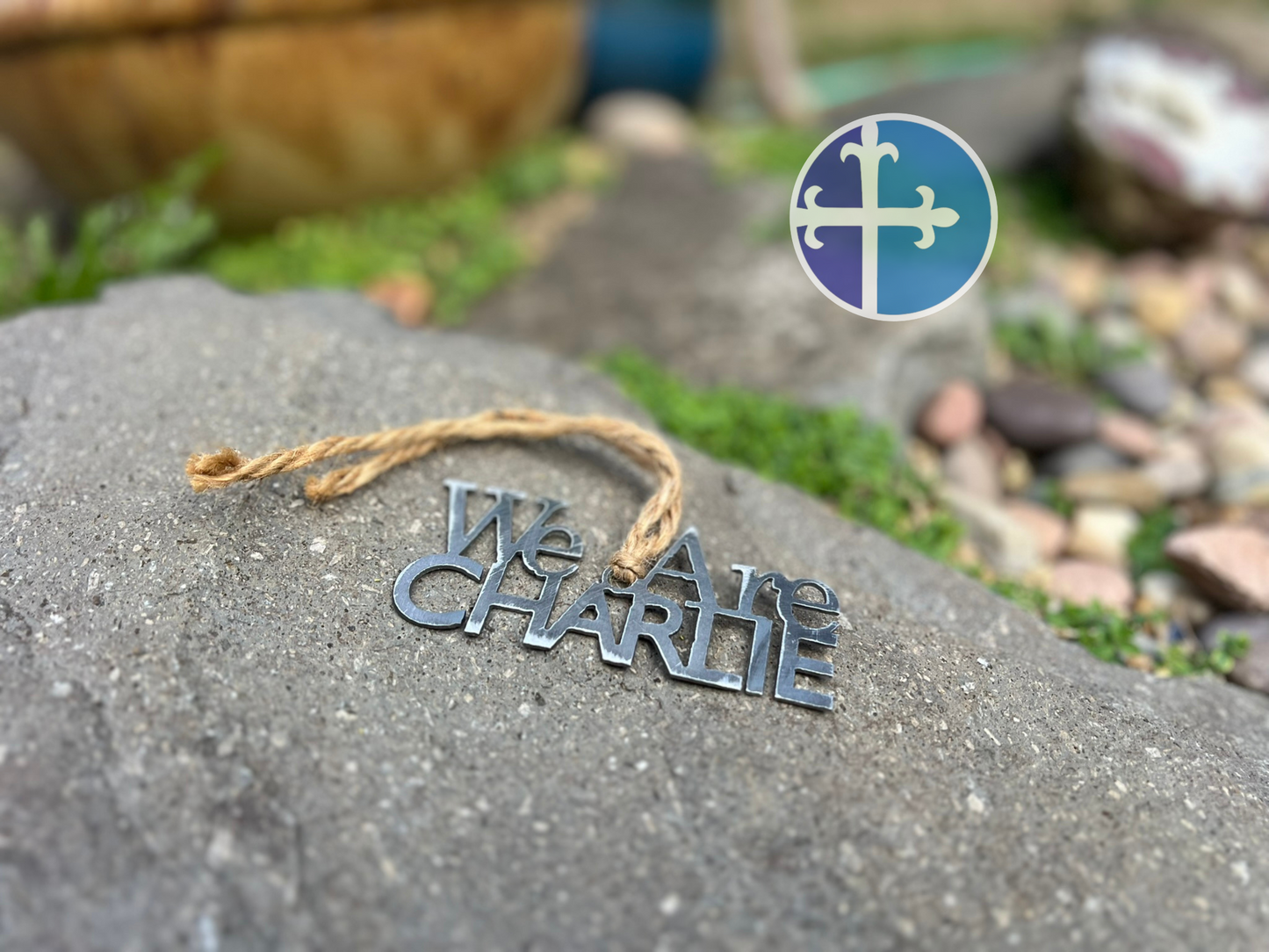 "We Are Charlie" tribute ornament with greenery, honoring conservative values.