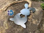 Load image into Gallery viewer, Close-up of a rustic steel bunny ornament with a heart cutout in the center, hanging from a jute twine on a textured stone background.
