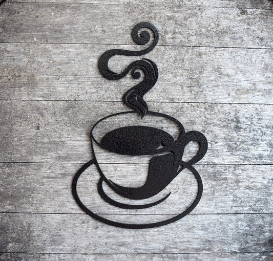 Discover artisanal craftsmanship in this hammered black painted steel coffee cup cutout, exuding rustic charm with its steamy allure. Elevate your decor with this unique and bold statement piece, perfect for adding warmth and character to any space.