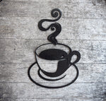 Load image into Gallery viewer, Discover artisanal craftsmanship in this hammered black painted steel coffee cup cutout, exuding rustic charm with its steamy allure. Elevate your decor with this unique and bold statement piece, perfect for adding warmth and character to any space.

