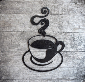 Discover artisanal craftsmanship in this hammered black painted steel coffee cup cutout, exuding rustic charm with its steamy allure. Elevate your decor with this unique and bold statement piece, perfect for adding warmth and character to any space.