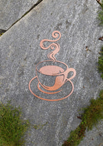 Load image into Gallery viewer, Enhance your home decor with a captivating hammered copper-painted steel cutout of a steaming coffee cup. This unique coffee-themed art piece adds warmth and sophistication to any room, making it a must-have for coffee lovers and interior design enthusiasts alike.
