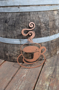 Enhance your decor with a hammered copper-painted steel coffee cup cutout, radiating warmth and sophistication, perfect for adding a cozy touch to any space